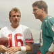 Joe Montana and Dan Marino were two of the biggest NFL stars in 1990. Marino ultimately signed over his marketing rights to the NFL, while Montana refused, but not out of solidarity with the NFLPA: he wanted a bigger cut than everybody else. (Photo credit: Doug Jennings/AP)